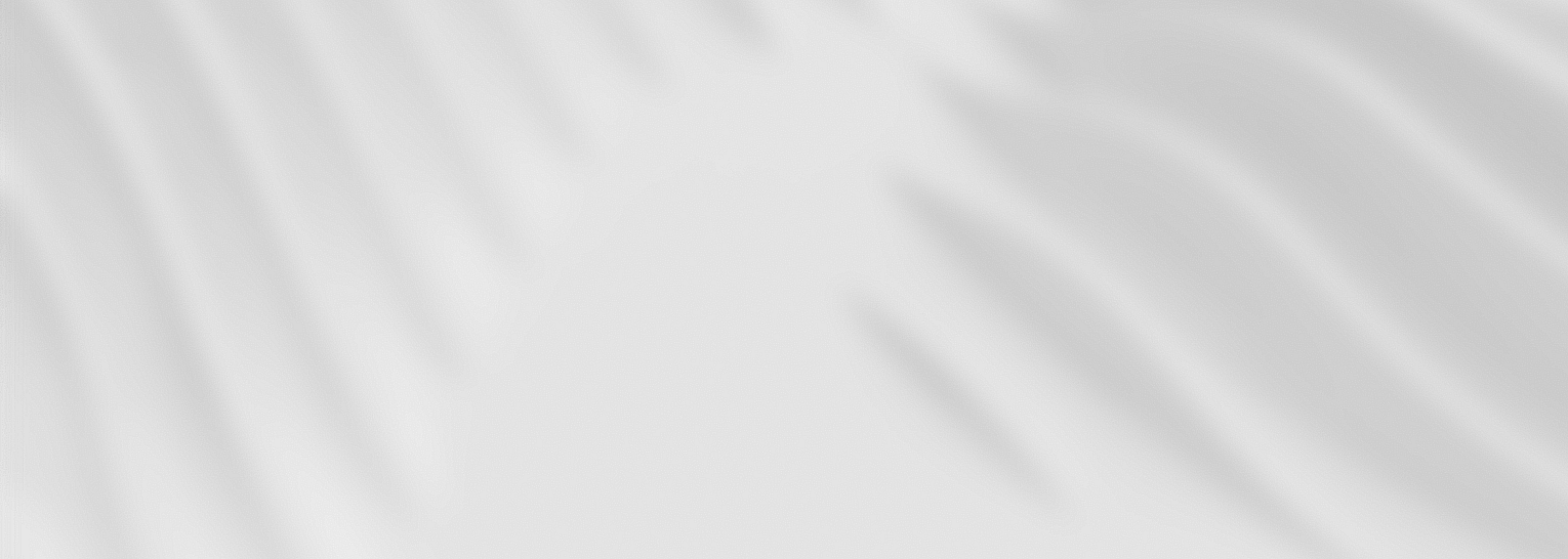 Abstract image featuring white and light gray wavy patterns, creating a smooth flowing texture across the composition.
